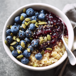 Blueberry Quinoa Breakfast Bowl with Pumpkin Seeds